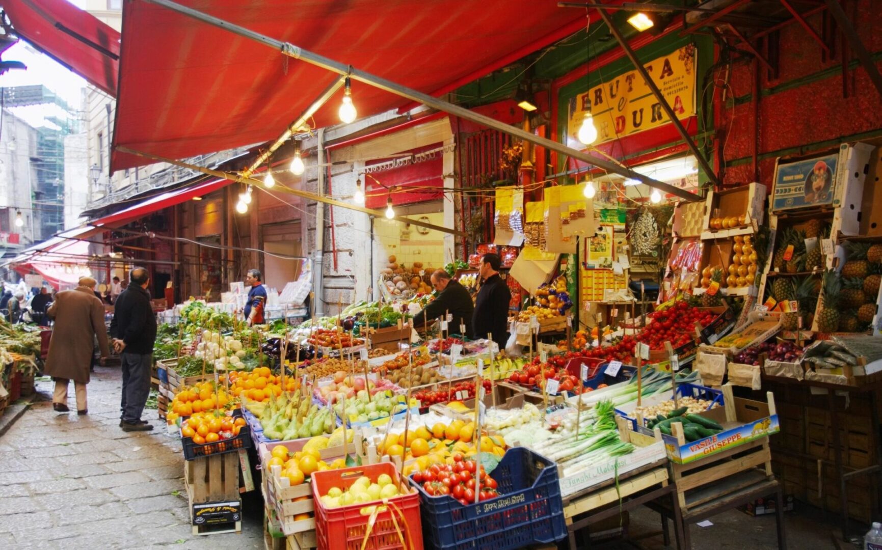 A market with fruits and vegetables on display.