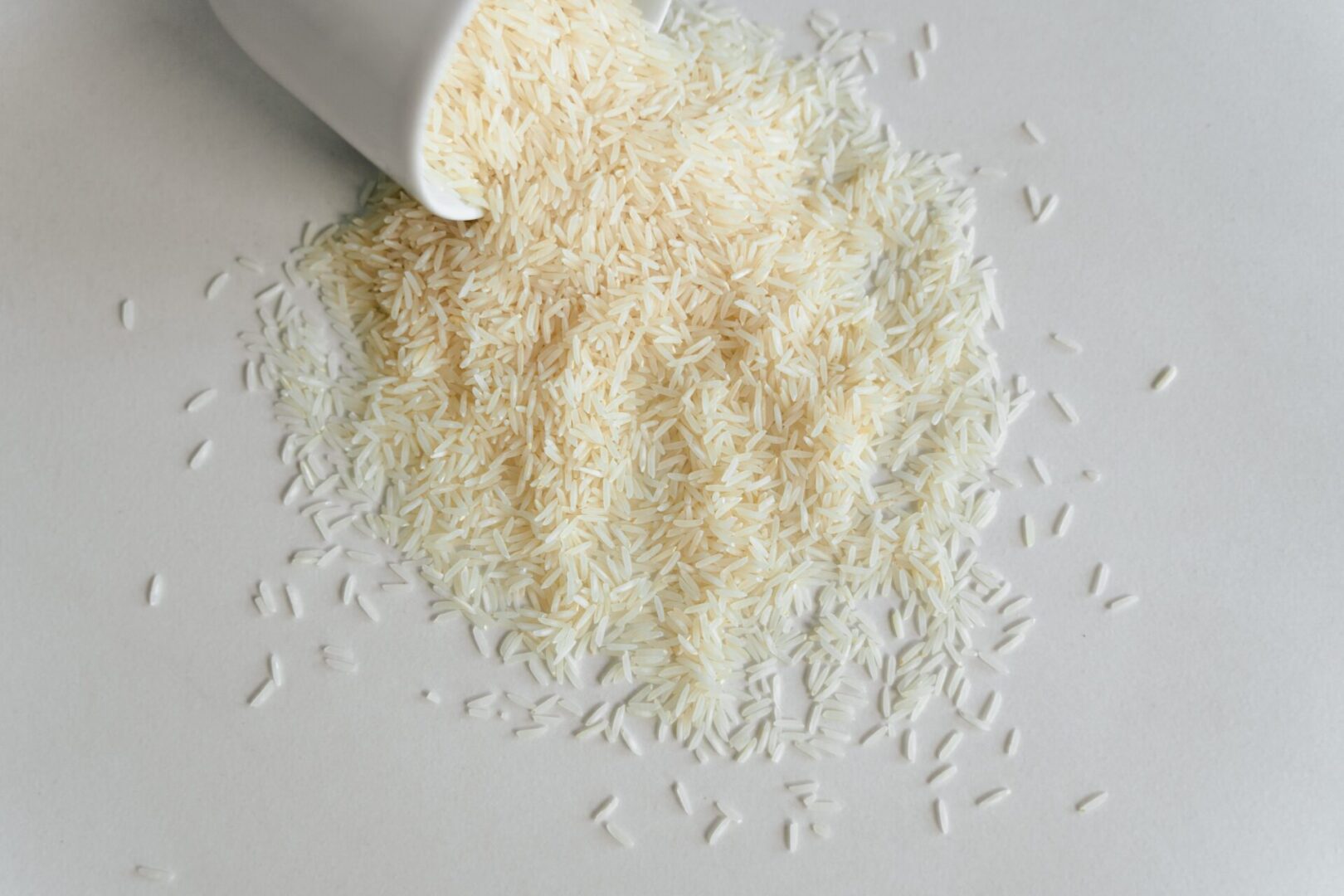 A white table with rice and a knife